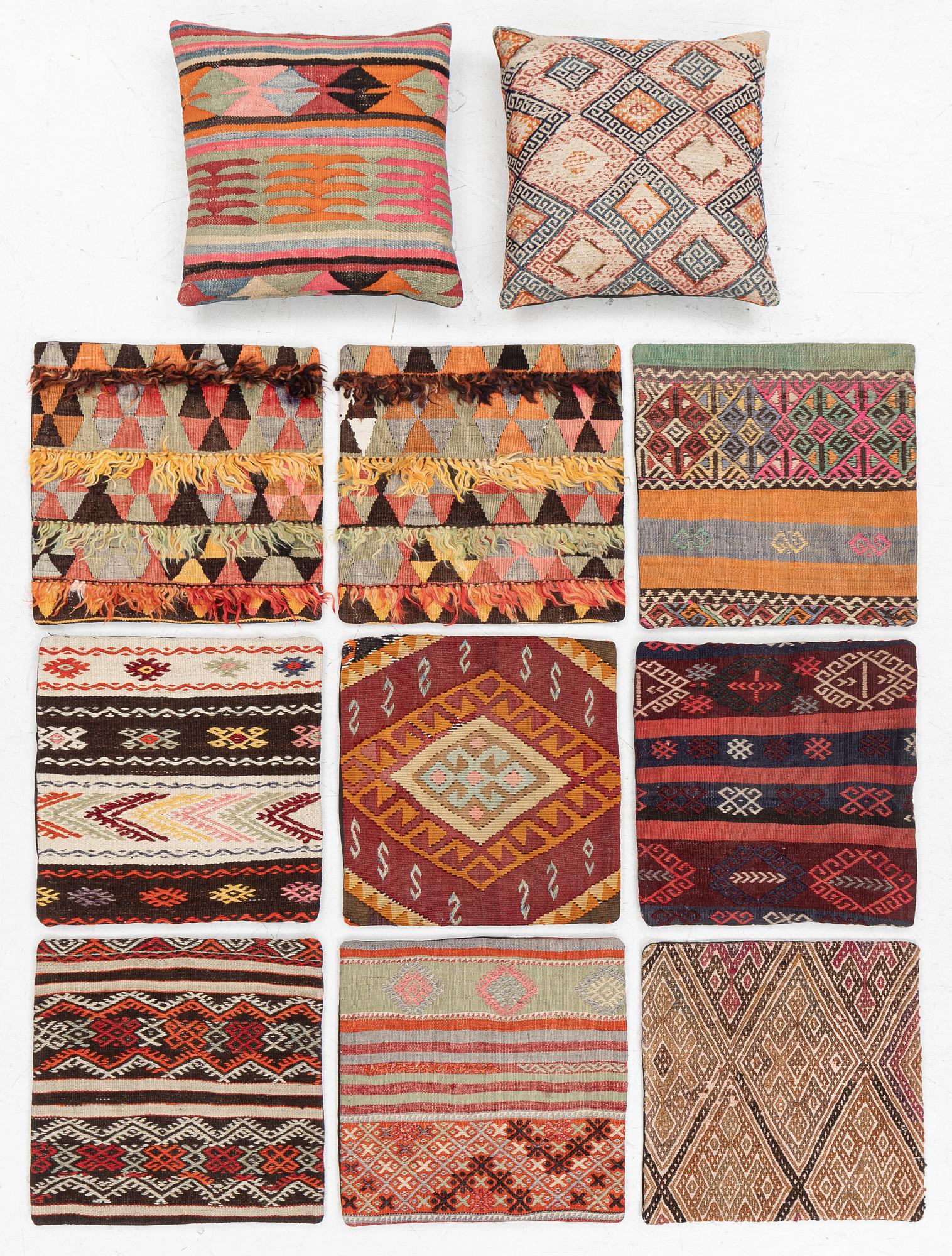 Nine Kilim pillow cases and two Kilim pillows, around 1970, ca. 50 x 50 cm.
