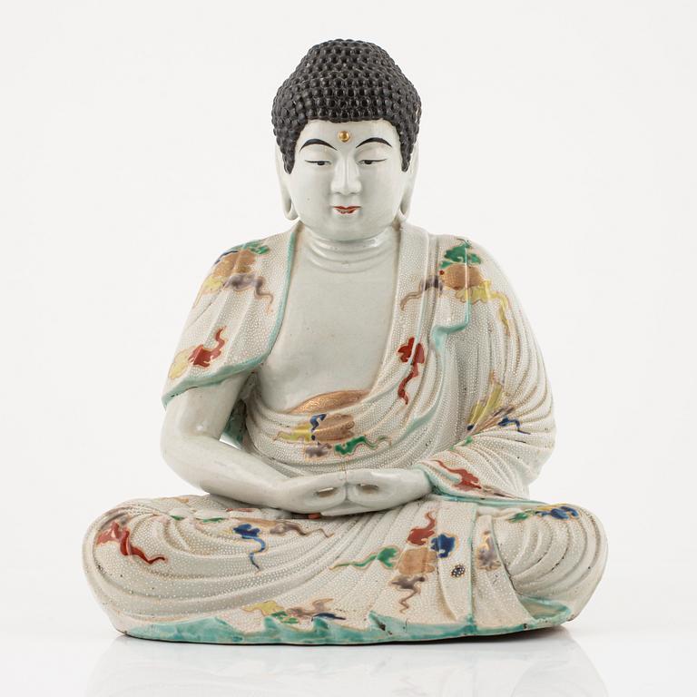 A porcelain buddha, Japan, 20th century.