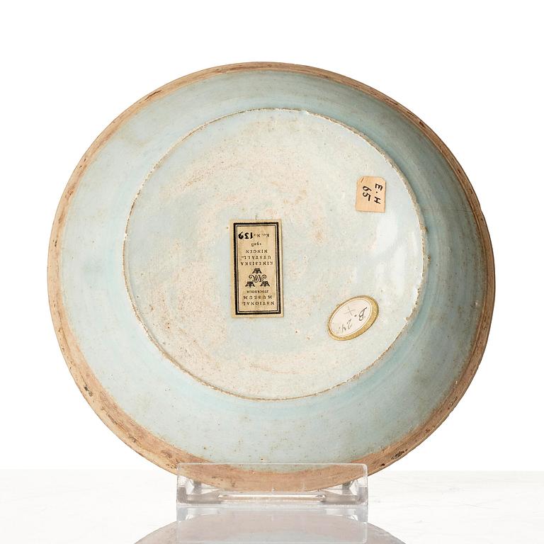 A qingbai dish with moulded decoration in pale celadon glaze, Southern Song dynasty (1127–1279).