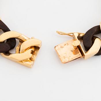 A Van Cleef & Arpels 18K gold and wood bracelet.