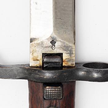 Three Swedish bayonets with scabbards.
