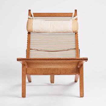 Hans J. Wegner, an oak lounge chair model "JH 524", Johannes Hansen, Copenhagen.