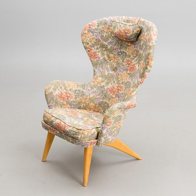 A mid-20th century armchair 'Siesta' manufacturer  Puunveisto Oy - Träsnideri Ab, Finland.