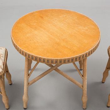 A mid 20th cenury table and a pair of stools.