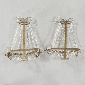 A pair of wall chandeliers from the first half of the 20th century.