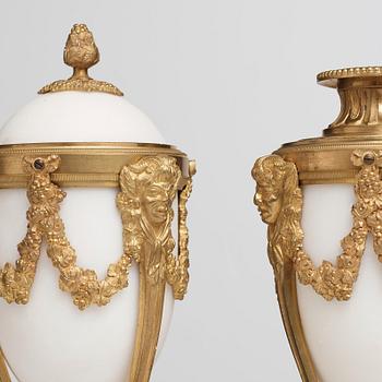 A pair of Louis XVI-style candlesticks, circa 1900.