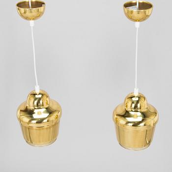 Alvar Aalto, A pair of  A 330, 'Golden Bell' pendant lights A330 for Artek, 2000s.