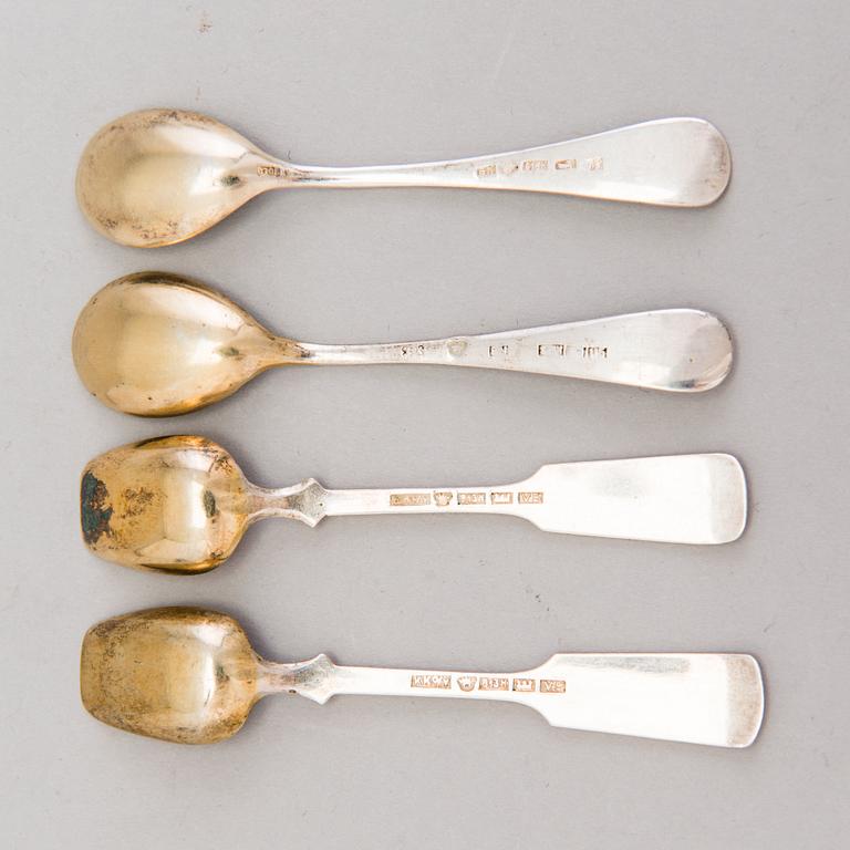 Four Russian 19th Century silver salt cellars and four Finnish 1920s parcel-gilt salt spoons.