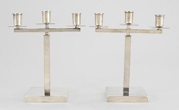 A pair of Swedish silver plated candelabra, attributed to Rolf Engströmer, by Fabriksaktiebolaget Kronsilver, 1930's.