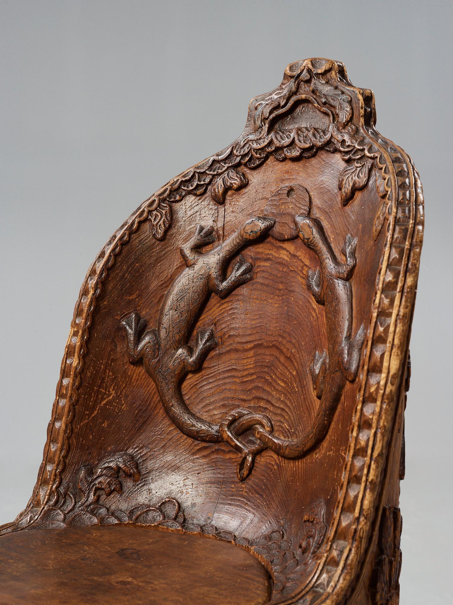 Knut Fjaestad, an Art Nouveau folk art sculptured pine chair, Sweden early 1900's.