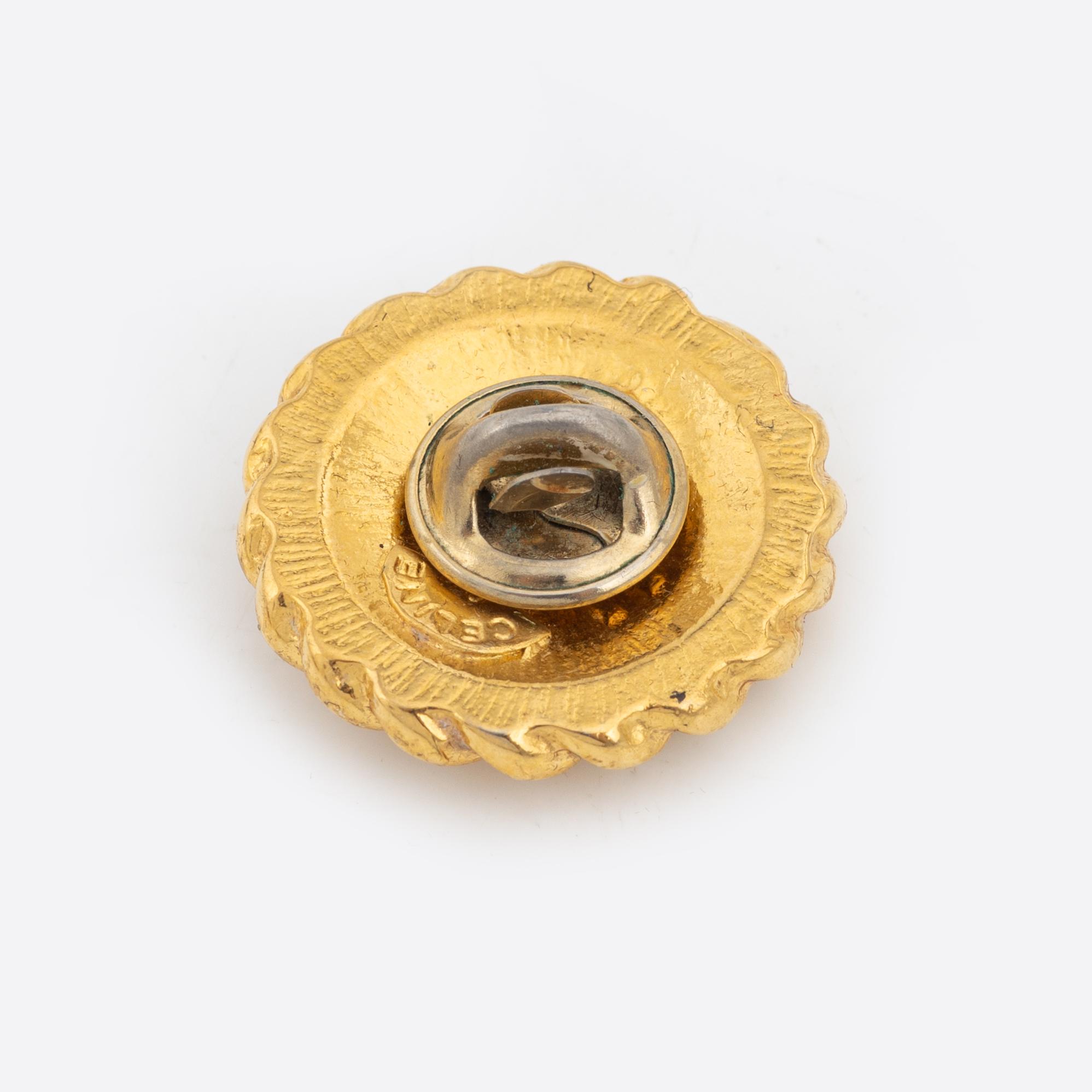 Céline, a set of four gold tone brooches.