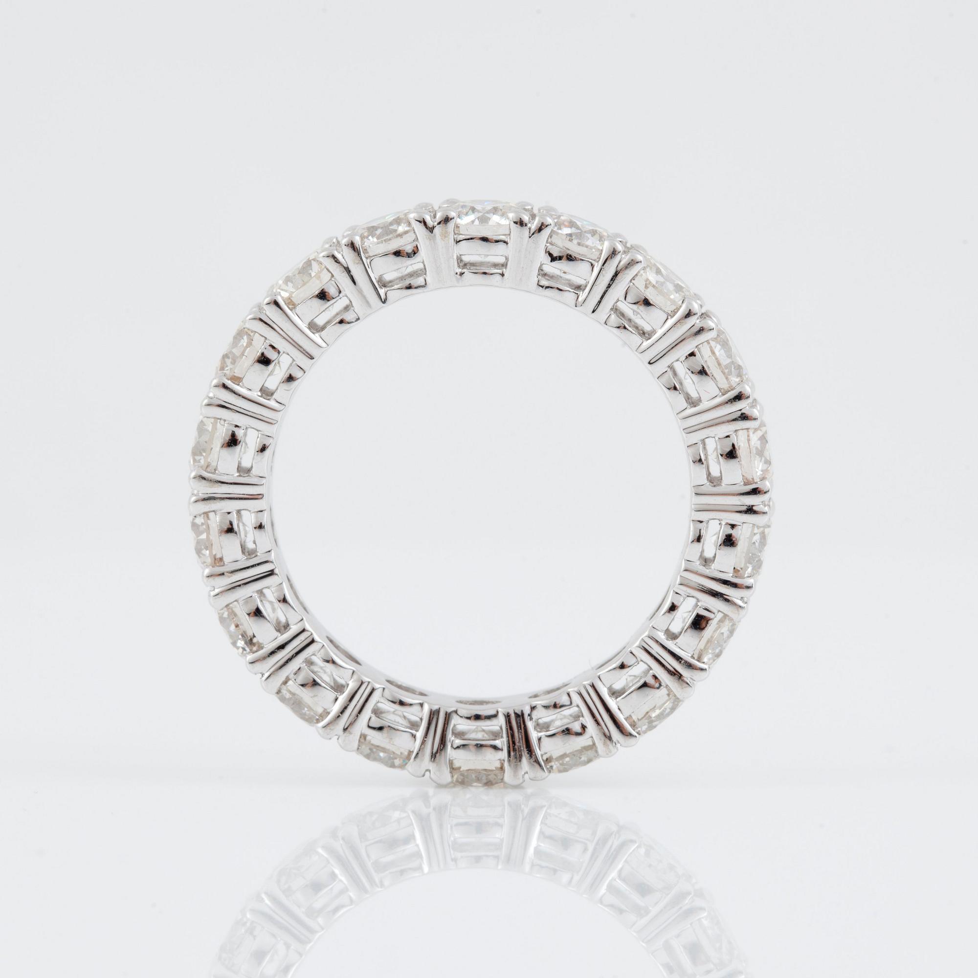 An eternity diamond ring, total carat weight 3.93 cts according to engraving. Quality circa I-K/SI.