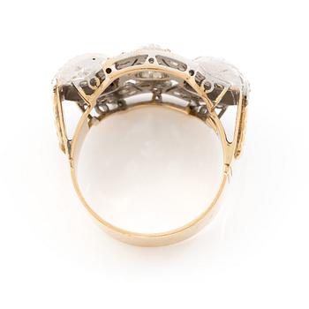 Ring in 18K gold and platinum set with an old-cut diamond and rose-cut diamonds.