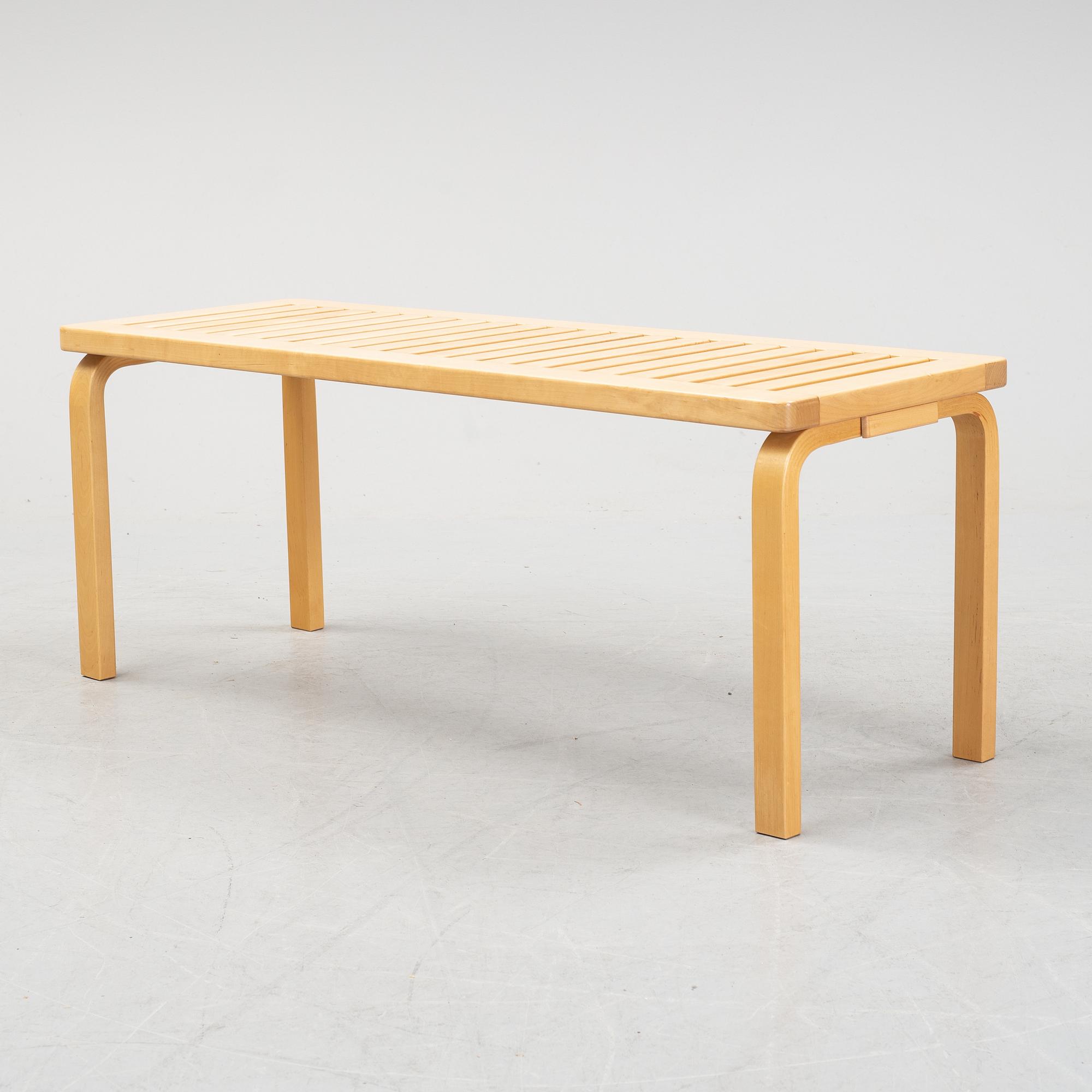 A bench and a stool by Alvar Aalto, from around the year 2000.