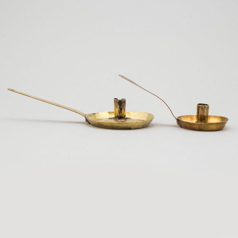 Two brass candlesticks, 18th century.