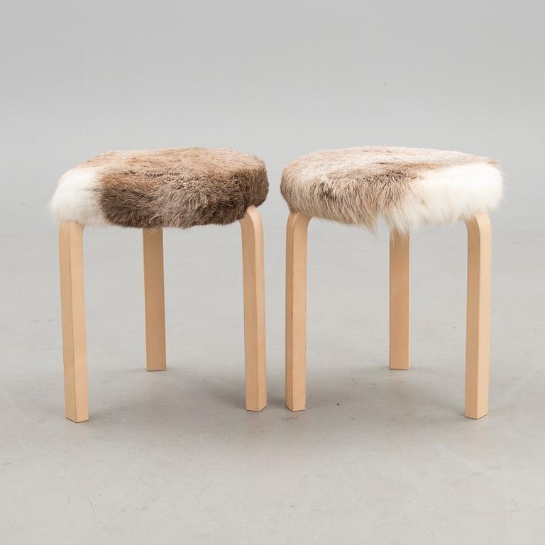 A pair of decorative stools, model 60 for Artek 2010. Upholstery design Ilse Crawford.