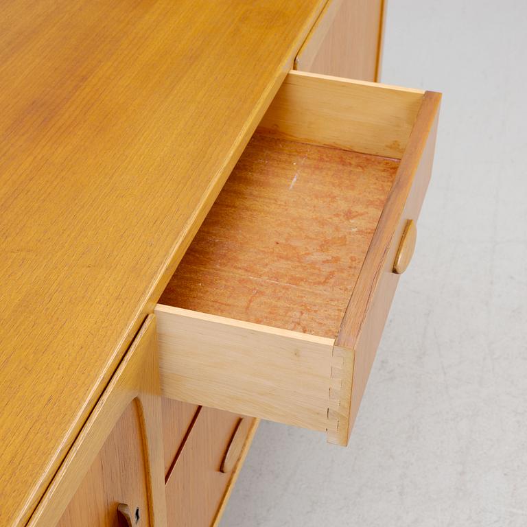 A Mid-20th Century Teak Sideboard.