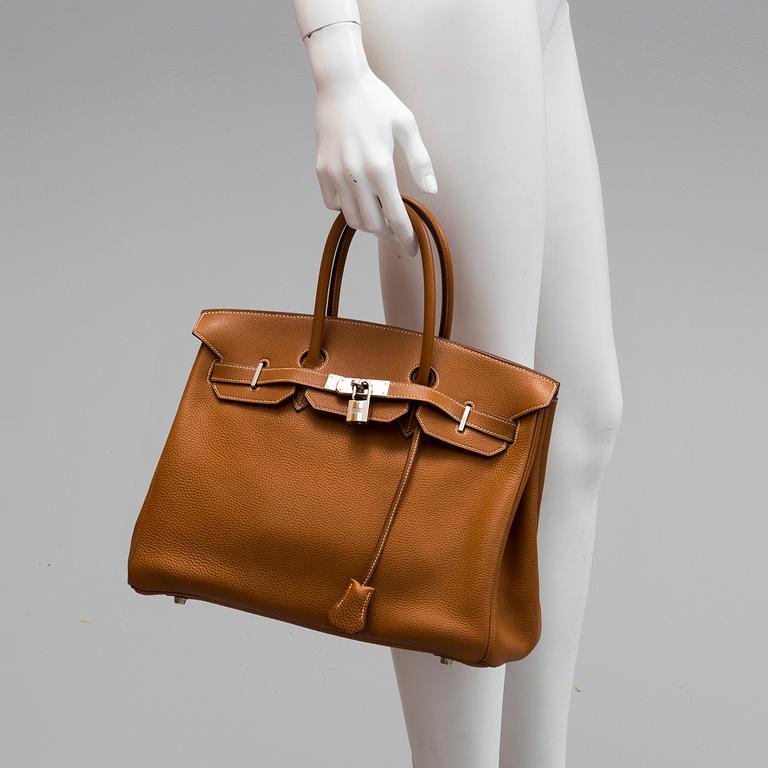 A gold togo Birkin 35 handbag by Hermès from 2004.