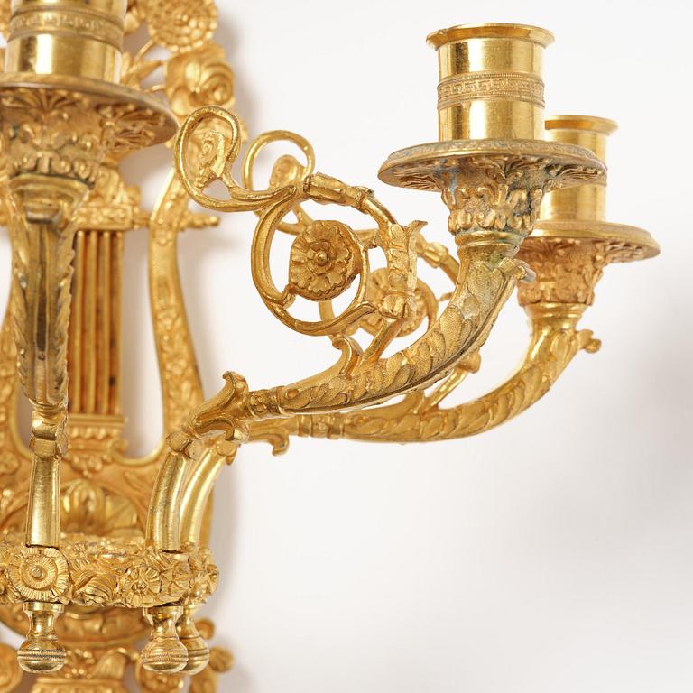 A pair of French 19th century gilt bronze five-light wall-lights.
