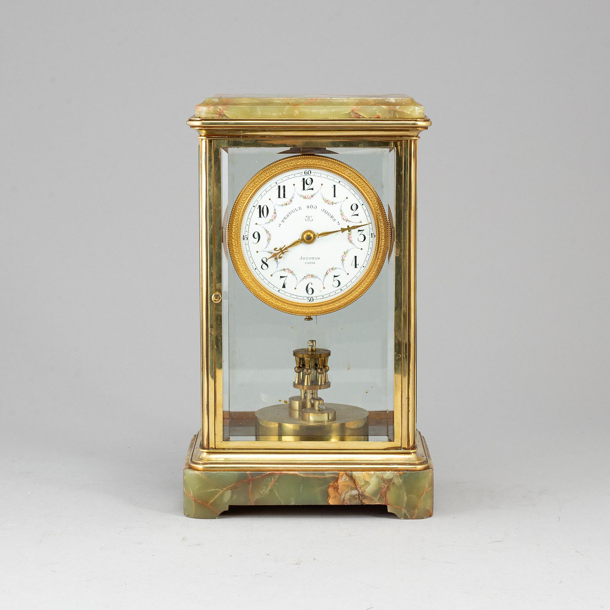 A French onyx and brass mantel clock, first half of the 20th century.