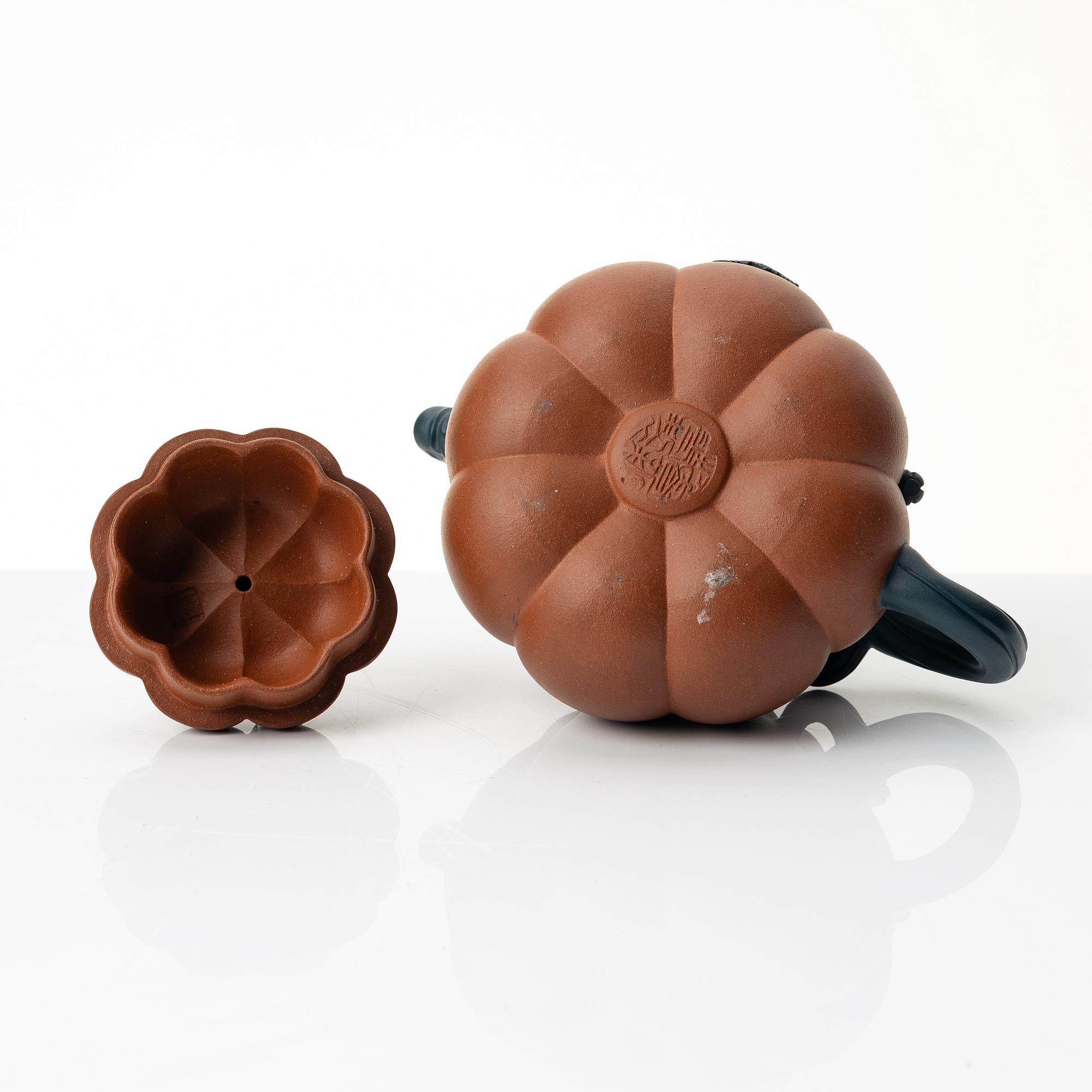 A Chinese yixing 'gourd' teapot, four cups and three saucers, 1980s.