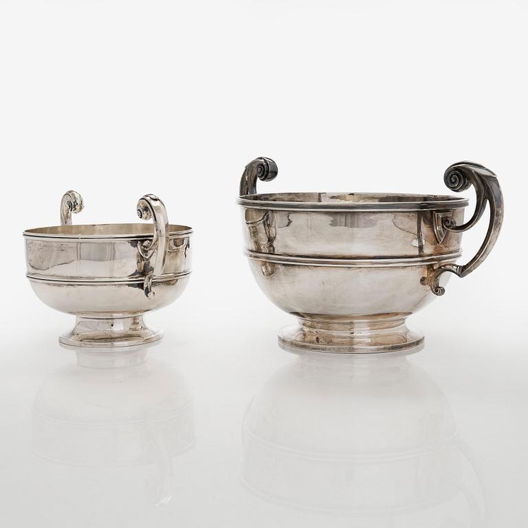A set of two bowls with handles, sterling silver, England.