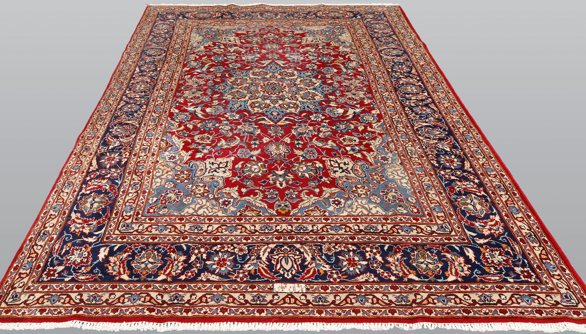 A signed Kashan carpet, ca 313 x 195 cm.