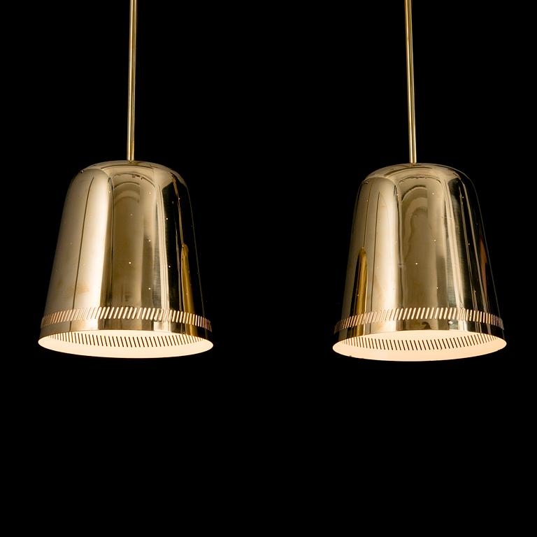 A pair of 1950s/60s pendant lights for Taito, Finland.
