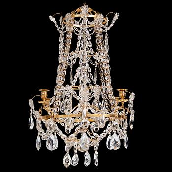 111. A Gustavian gilt-brass and cut-glass four-branch chandelier by O. Westerberg (master in Stockholm 1769-1881), dated 1795.