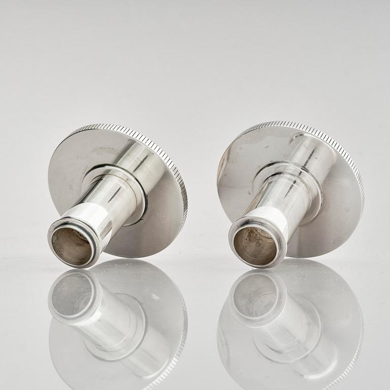 Georg Jensen, a pair of sterling silver candlesticks, design by Sigvard Bernadotte, model no 711A, Copenhagen, Denm after 1945.