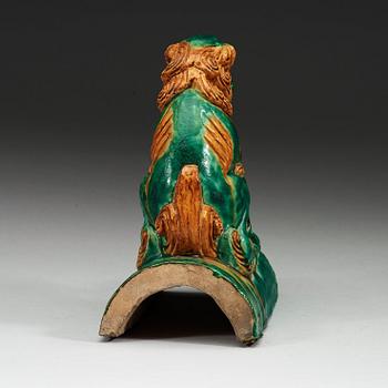 A sancai glazed roof tile figure of a mythological animal, Ming dynasty, 17th Century.