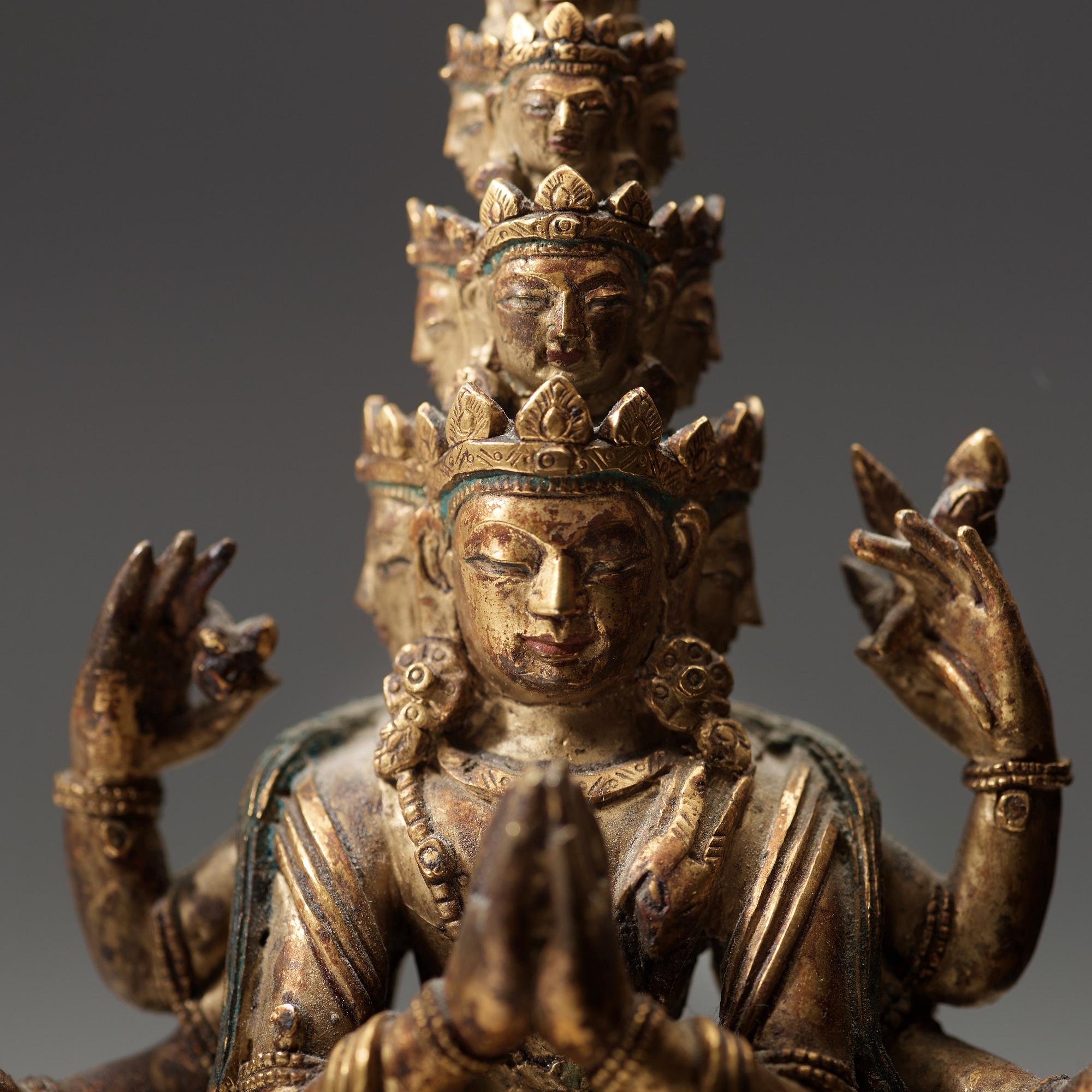 A standing figure of a 11-head Avalokiteshvara with eight arms, Tibet, circa 1800.