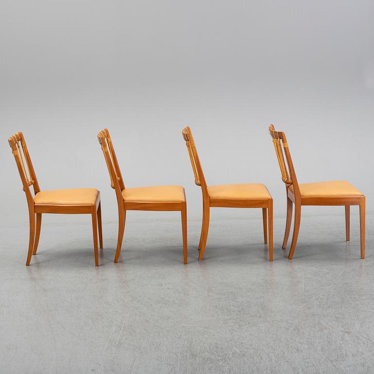 A set of four of Josef Frank mahogany and rattan dining chairs, Svenskt Tenn, Stockholm, Sweden.