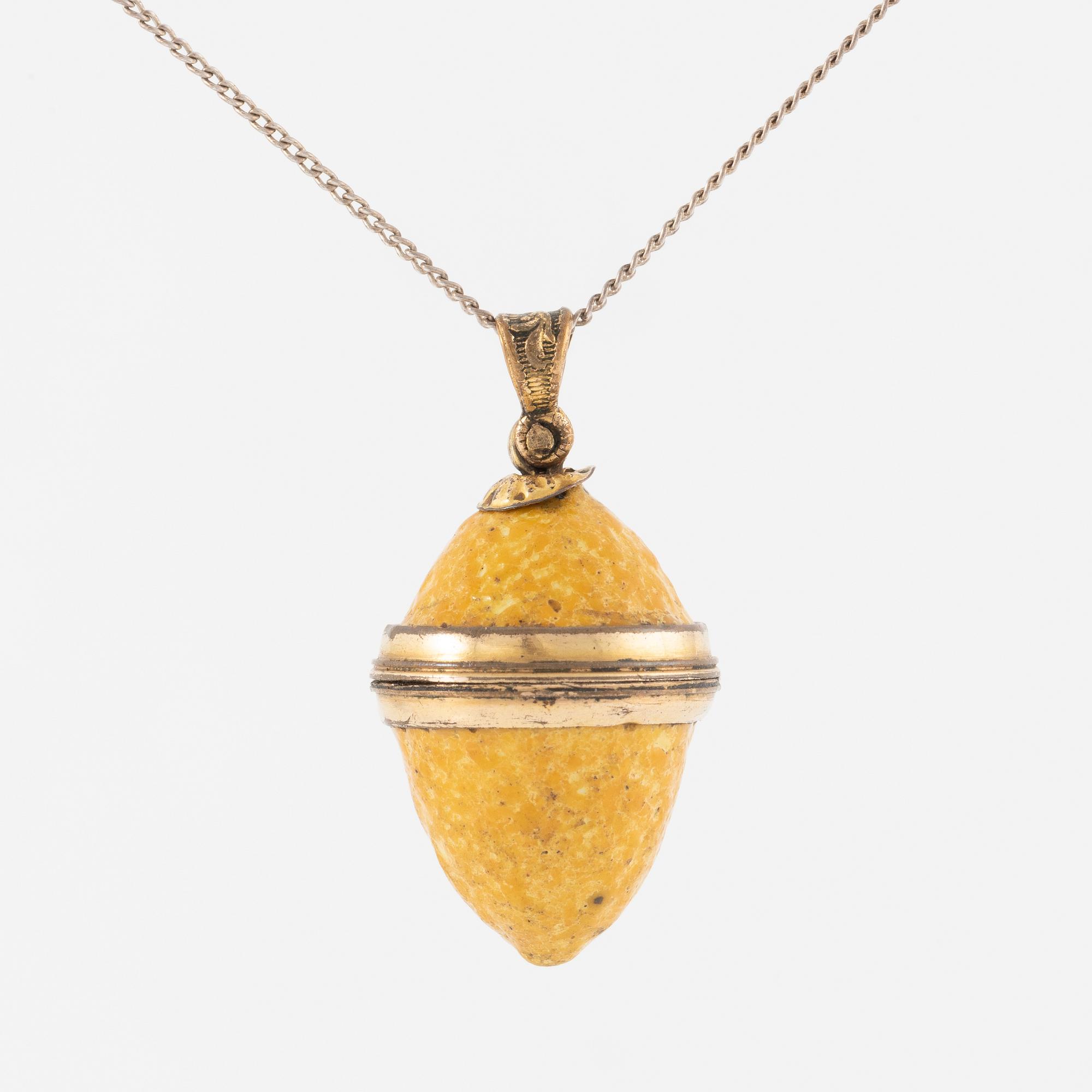 Charm in the form of a lemon with yellow enamel.