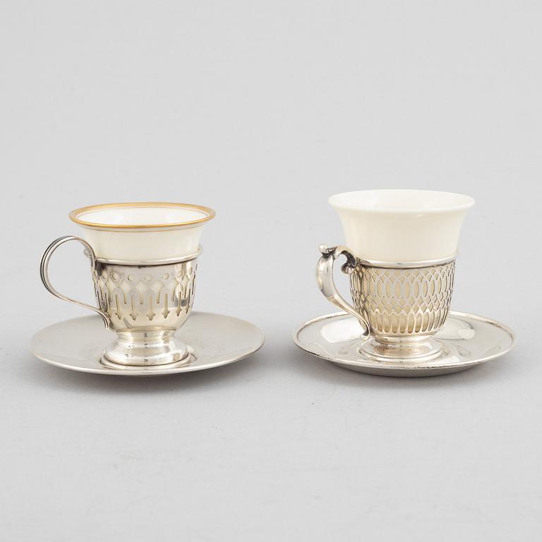 Kopphållare med fat, 6+6 st, sterlingsilver och porslin, bl.a. John Wanamaker, Philidelphia, USA, tidigt 1900-tal.