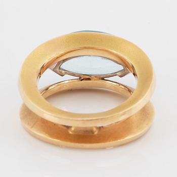 18K gold and navette shaped blue topaz.