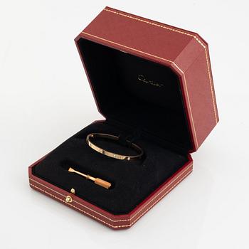 A Cartier "Love" bracelet small model in 18K rose gold with ten round brilliant-cut diamonds.