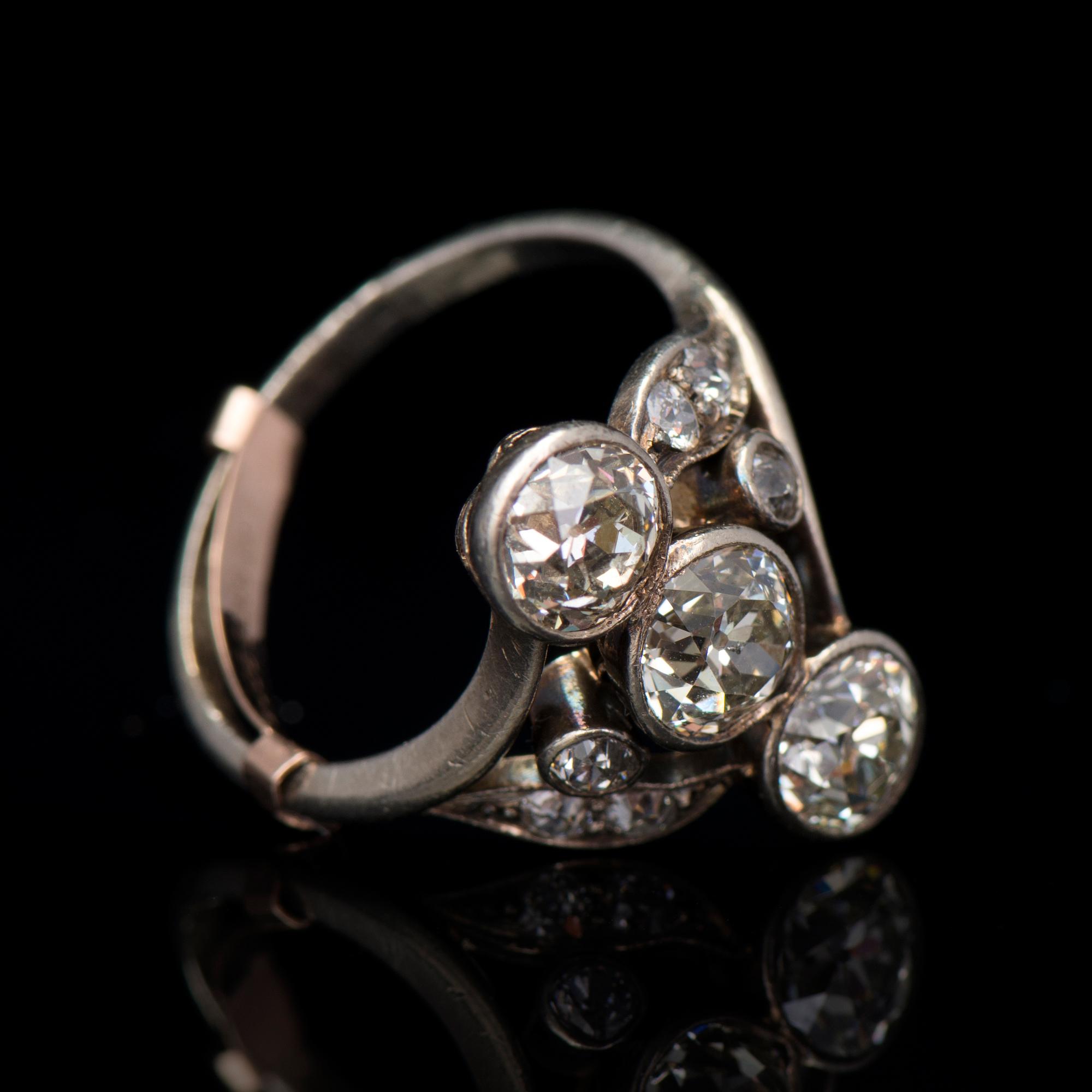 A RING, old cut diamonds, silver.