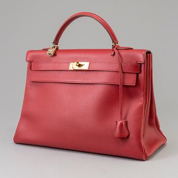 A red Epson "Kelly 40" bag by Hermès 1991.