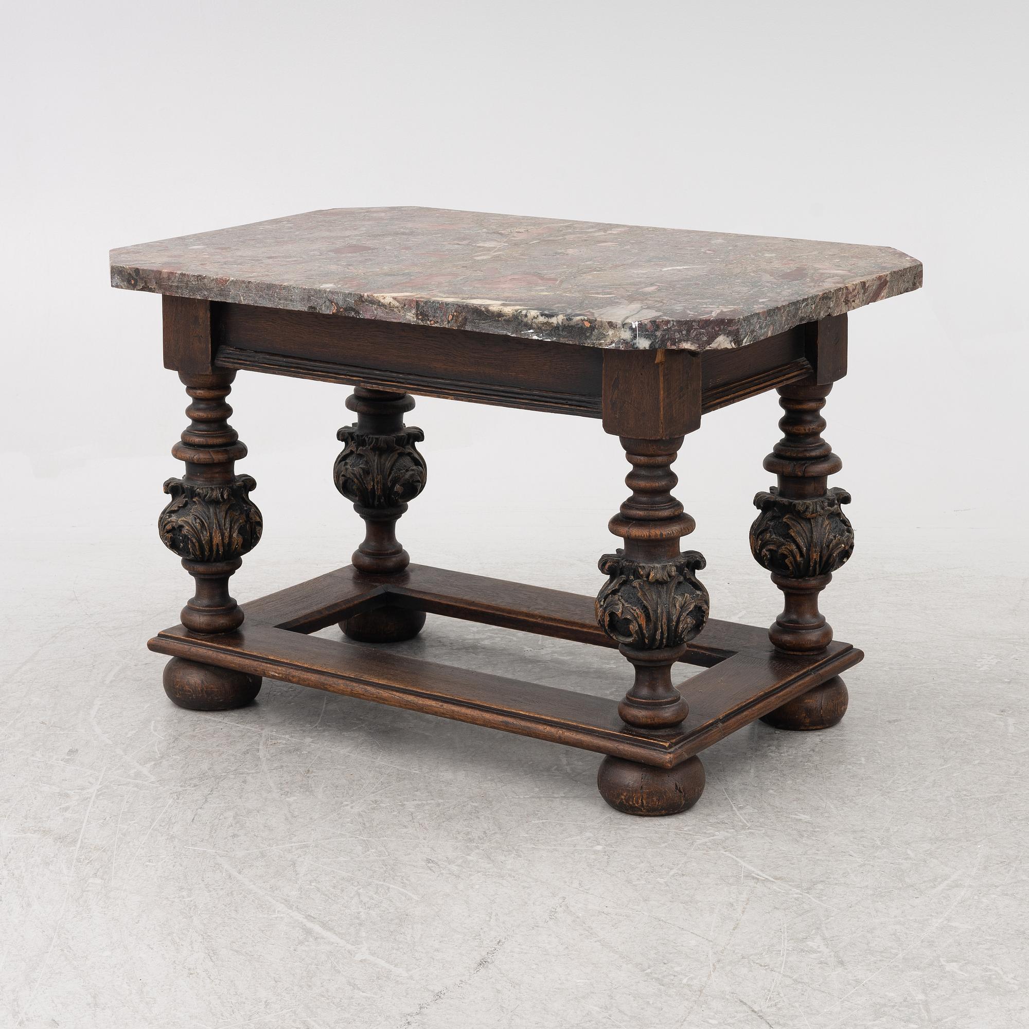 A 19th century Baroque style stone-top table.
