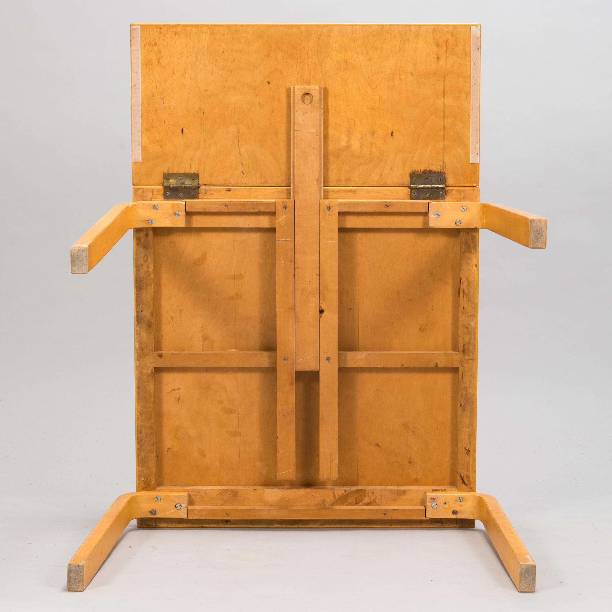 Alvar Aalto, a mid 20th century 'DL85' folding table, seven chairs for Artek.