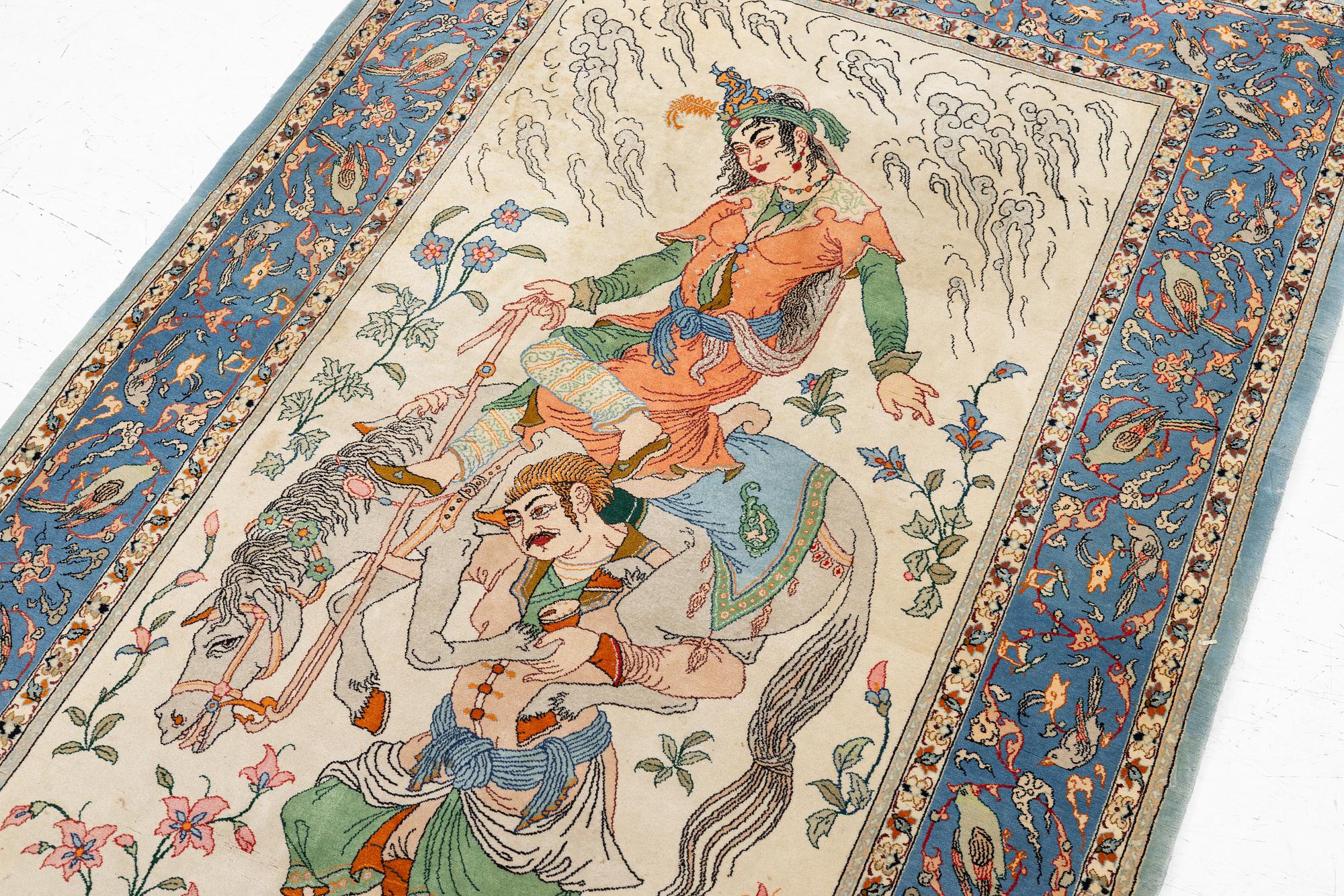 An Isfahan, figural rug, signed, c. 172 x 109 cm.