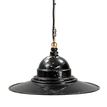 An early 20th century industrial lamp.