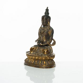 A gilt copper figure of Amitayus, Tibeto-Chinese, 18th Century.