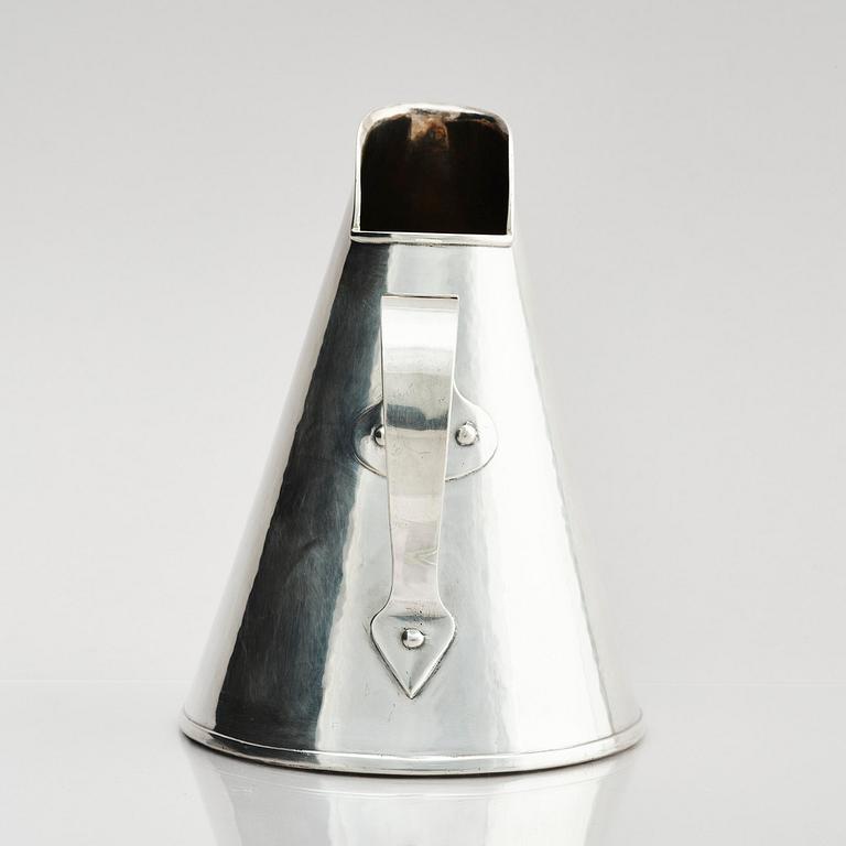 G H Markenius, a silver pitcher with handle, Stockholm 1957.