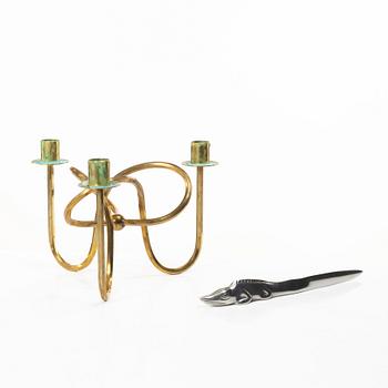 Firma Svenskt Tenn, Candelabrum, 'Vänskapsknuten', and paper knife, 'Alligator'.