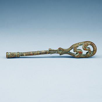An archaistic tuning key for a Qin instrument.