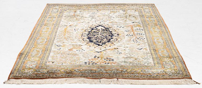 A Ghom, figural, silk rug, c. 205 x 140 cm.