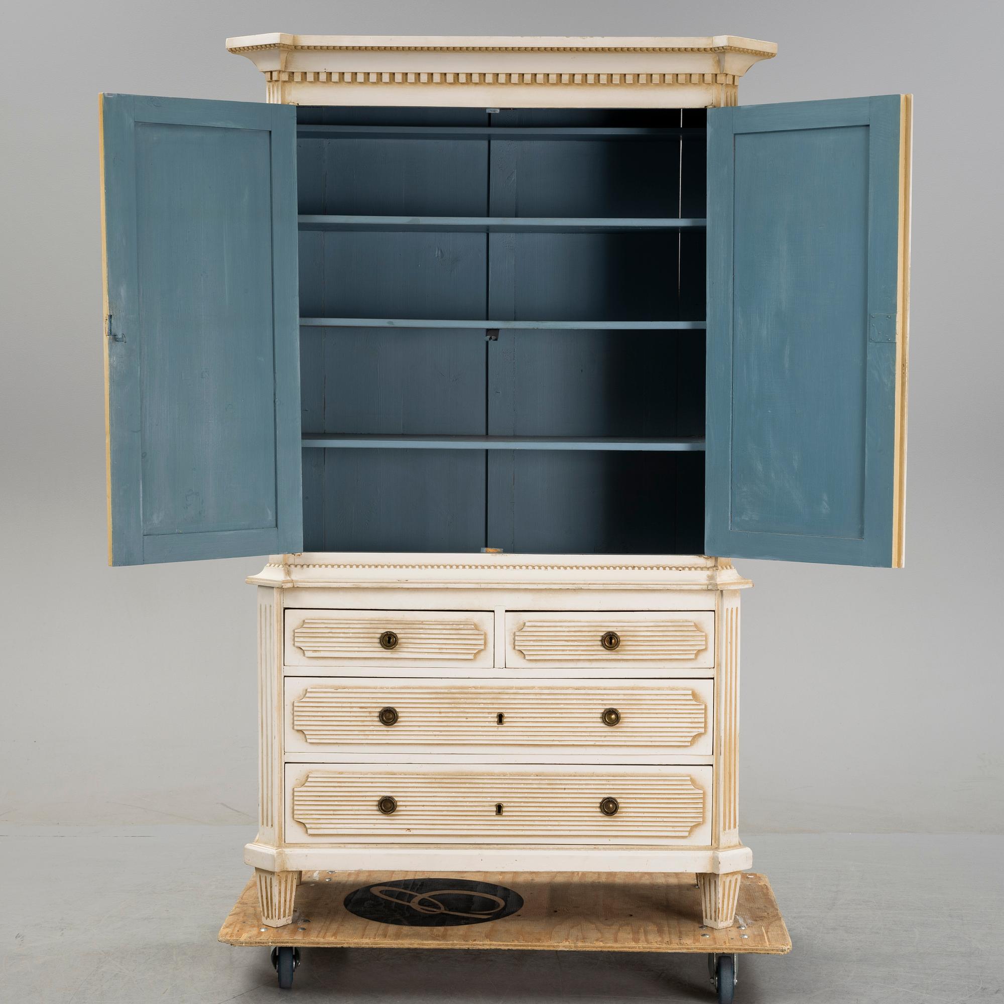 A gustavian style cabinet, circa 1900.