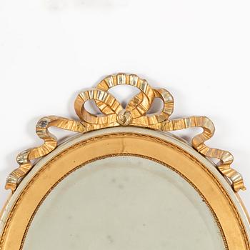 A gustavian style mirror, first half of the 20th century.